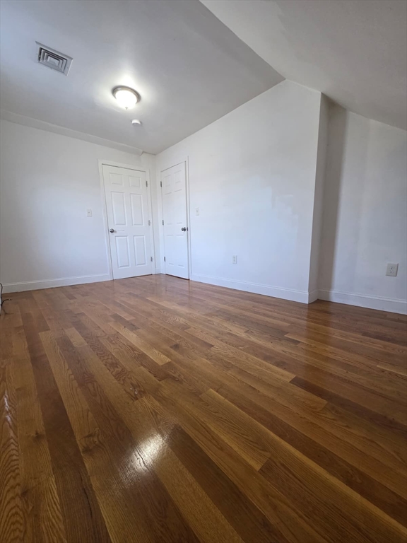 61 Crescent Street, Unit 3 Chelsea, MA 02150 - Photo 2 of 12 a view of an empty room and wooden floor