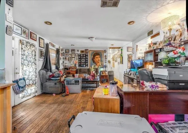 a view of a dining room with furniture and a kitchen