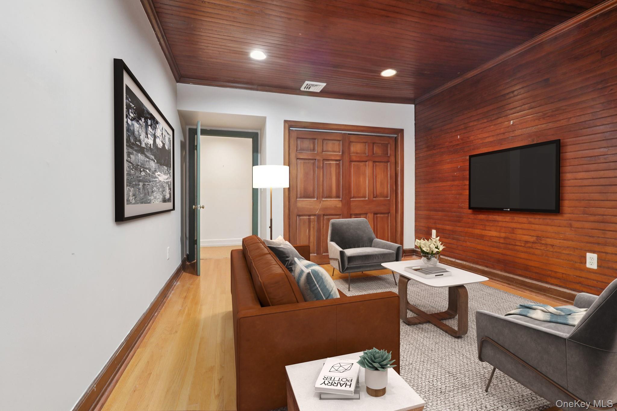 32 East Lake Stable Road Tuxedo Park, NY 10987 - Photo 32 of 49 a living room with furniture and a flat screen tv