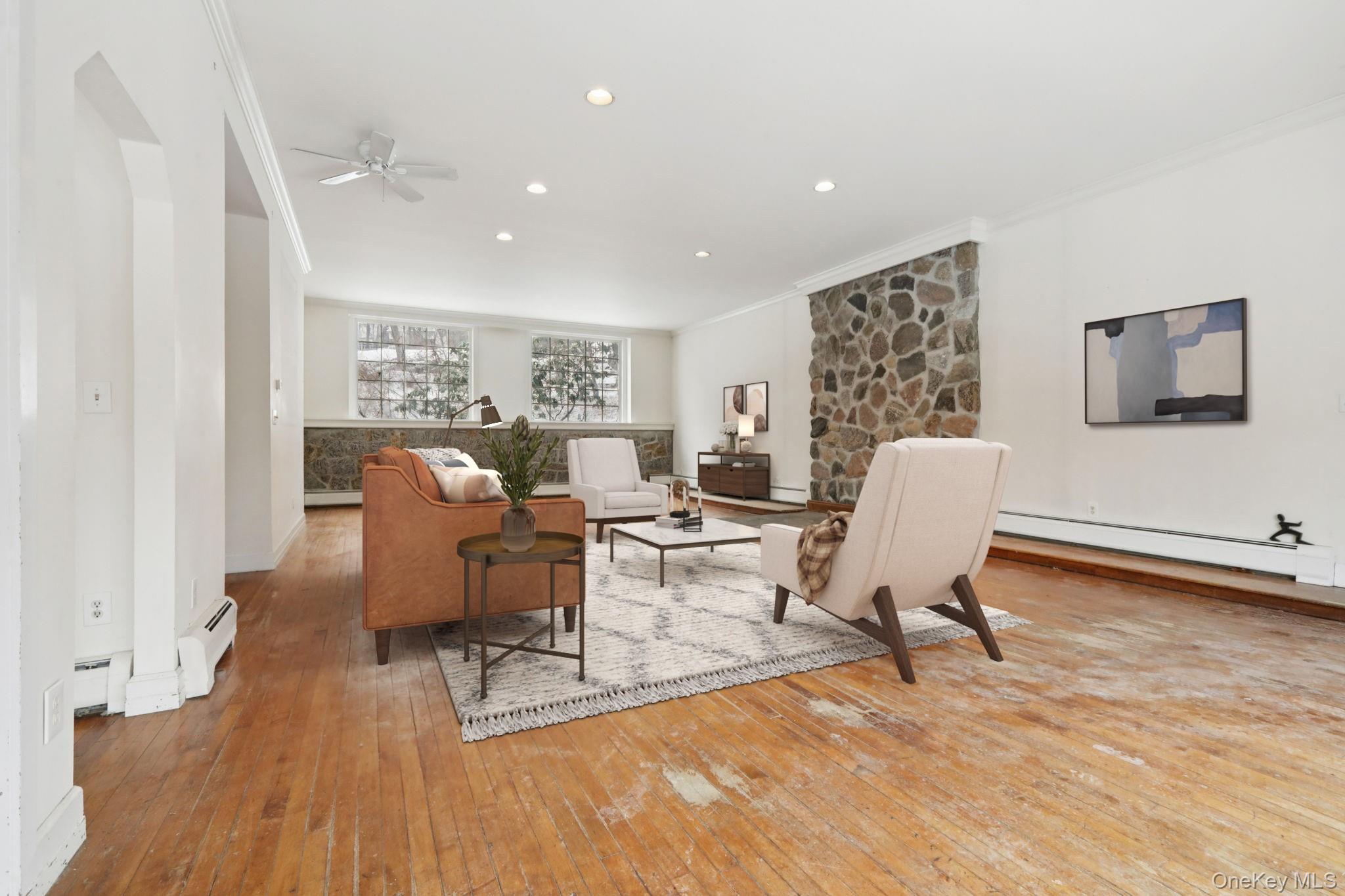 32 East Lake Stable Road Tuxedo Park, NY 10987 - Photo 6 of 49 a living room with furniture a dining table and a potted plant