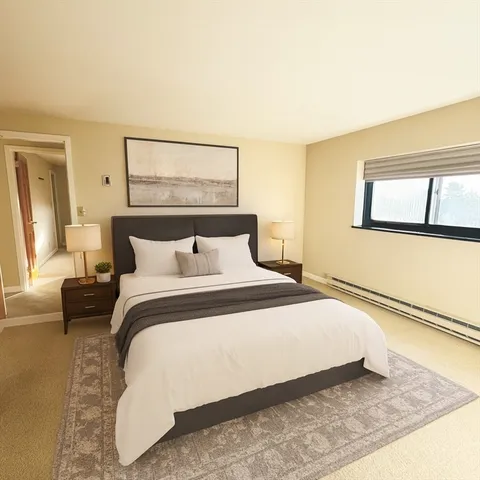 a bedroom with a bed and window