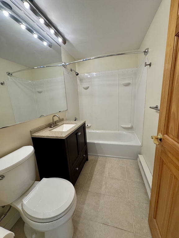 1321 Worcester Road, Unit 603 Framingham, MA 01701 - Photo 13 of 23 a bathroom with a sink toilet and shower