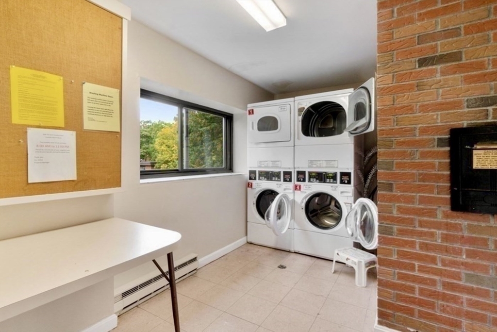 1321 Worcester Road, Unit 603 Framingham, MA 01701 - Photo 15 of 23 a utility room with dryer and washer