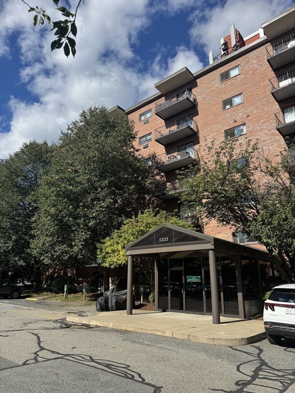 1321 Worcester Road, Unit 603 Framingham, MA 01701 - Photo 20 of 23 front view of house with a street