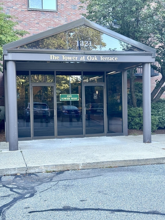 1321 Worcester Road, Unit 603 Framingham, MA 01701 - Photo 21 of 23 a front view of a building with glass door