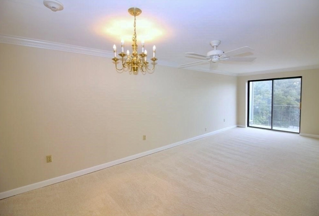 1321 Worcester Road, Unit 603 Framingham, MA 01701 - Photo 3 of 23 a view of an empty room with a window
