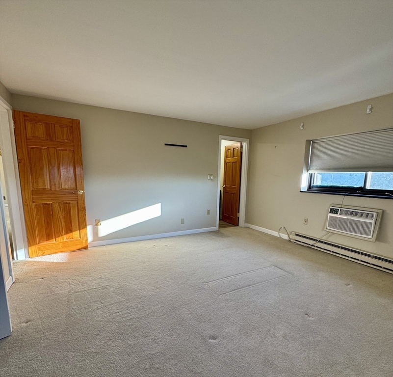 1321 Worcester Road, Unit 603 Framingham, MA 01701 - Photo 7 of 23 a view of an empty room with a window