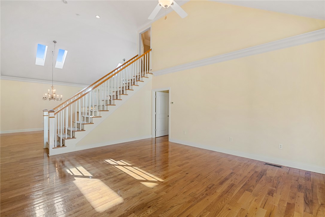 16 Oleander Drive Anderson, SC 29621 - Photo 9 of 37 Hardwood floors and high ceilings elevate this generous living space, bathed in natural light from above.