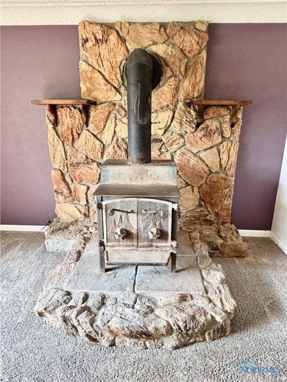 1105 South Lallendorf Road Oregon, OH 43616 - Photo 8 of 49 Stone wall wood burning stove.
