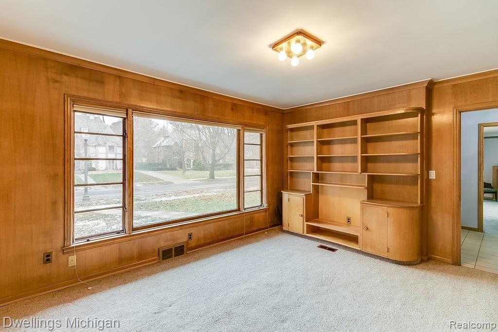 19410 Canterbury Road Detroit, MI 48221 - Photo 16 of 39 The paneling is Birchwood as well as all the doors and custom shelving