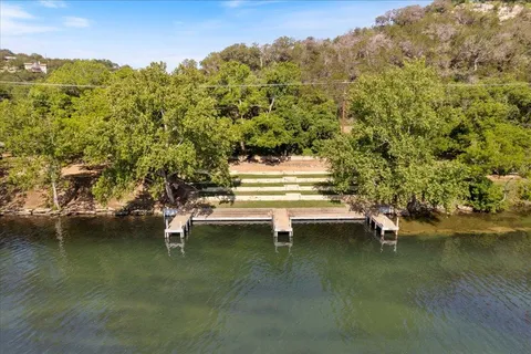 a view of ocean with green space