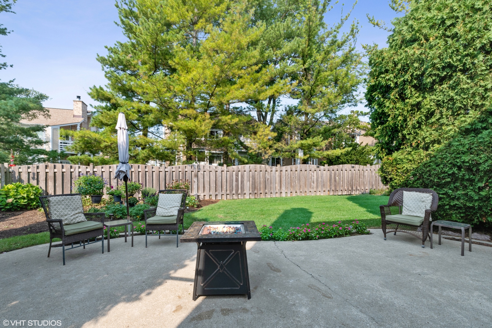 1331 Devonshire Road Buffalo Grove, IL 60089 - Photo 15 of 15 a garden with a bench and some trees