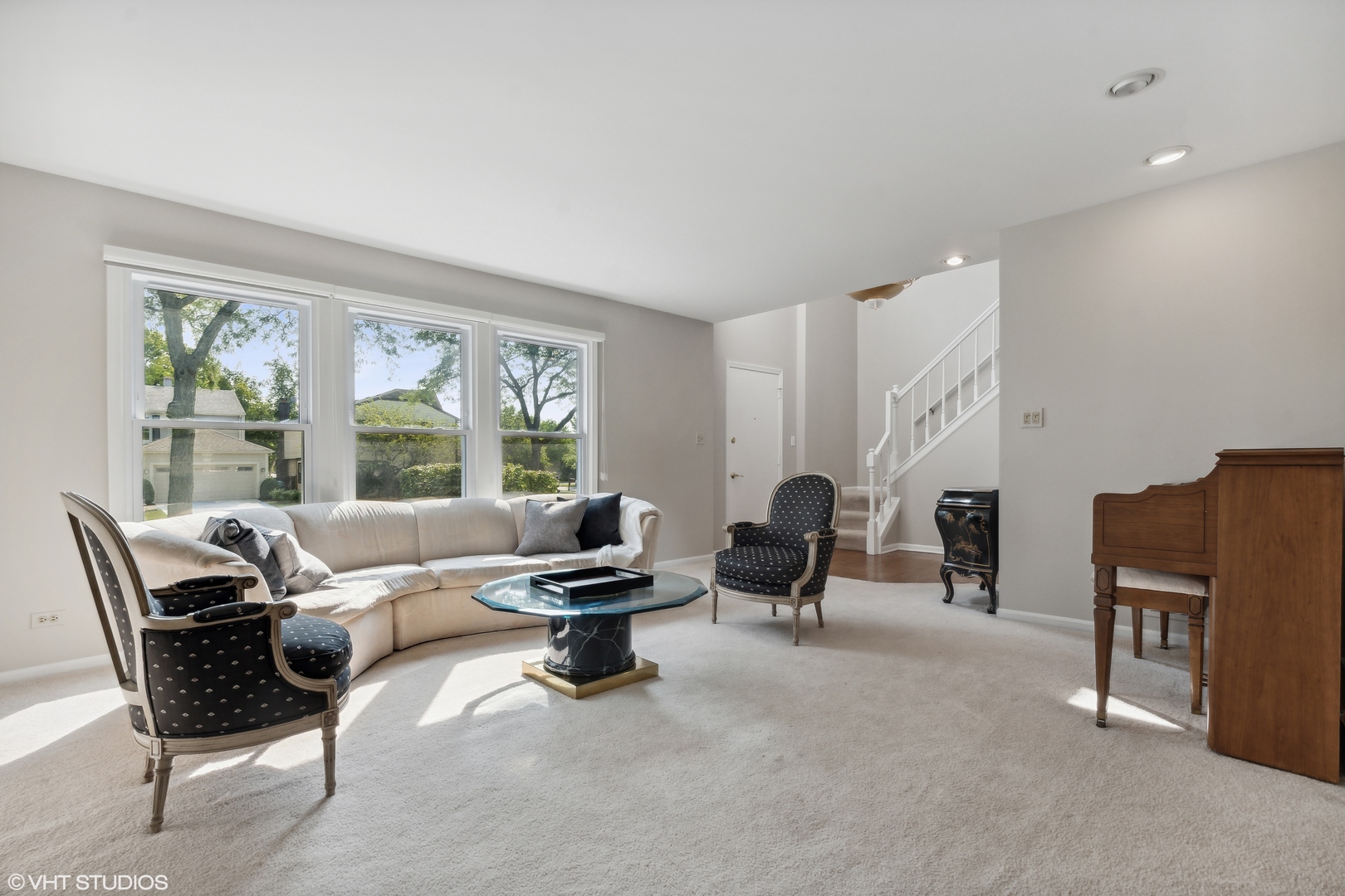 1331 Devonshire Road Buffalo Grove, IL 60089 - Photo 2 of 15 a living room with furniture and large windows