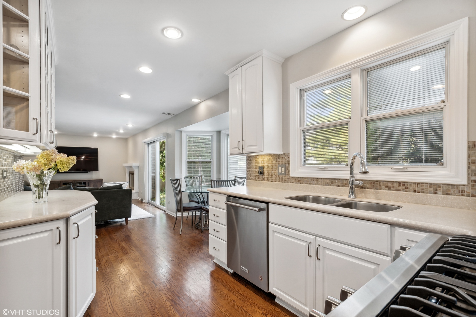 1331 Devonshire Road Buffalo Grove, IL 60089 - Photo 6 of 15 a kitchen with a sink stove and cabinets