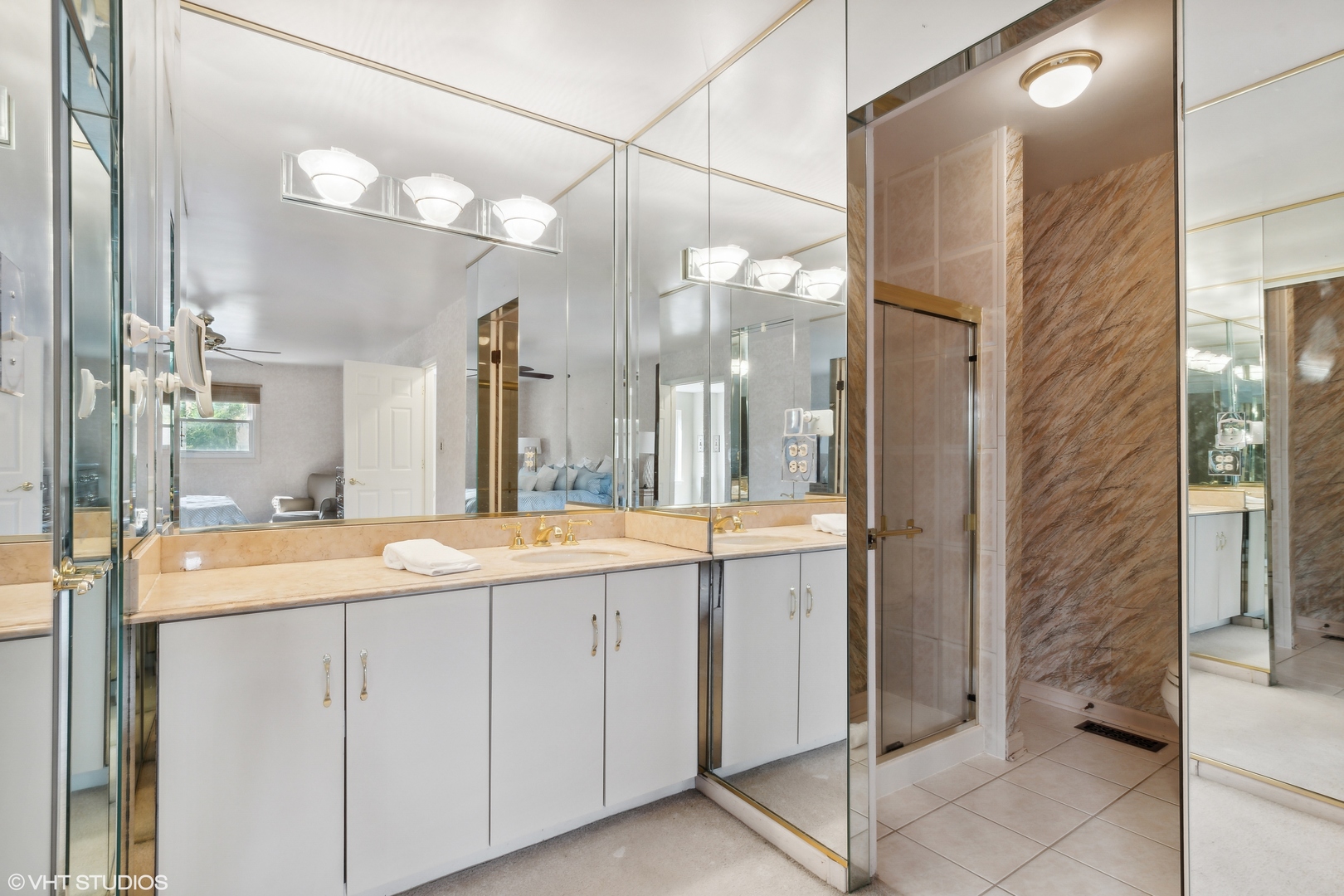 1331 Devonshire Road Buffalo Grove, IL 60089 - Photo 9 of 15 a bathroom with a double vanity sink and mirror with bathtub