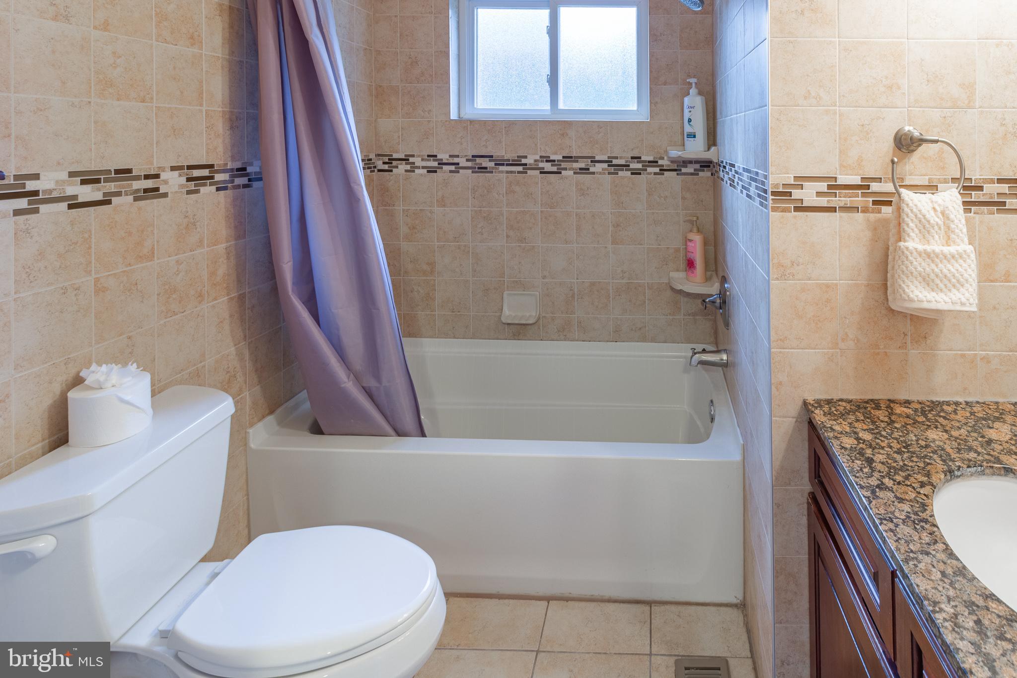 1588 Williams Road Abington, PA 19001 - Photo 26 of 34 a bathroom with a granite countertop bathtub shower sink vanity and toilet