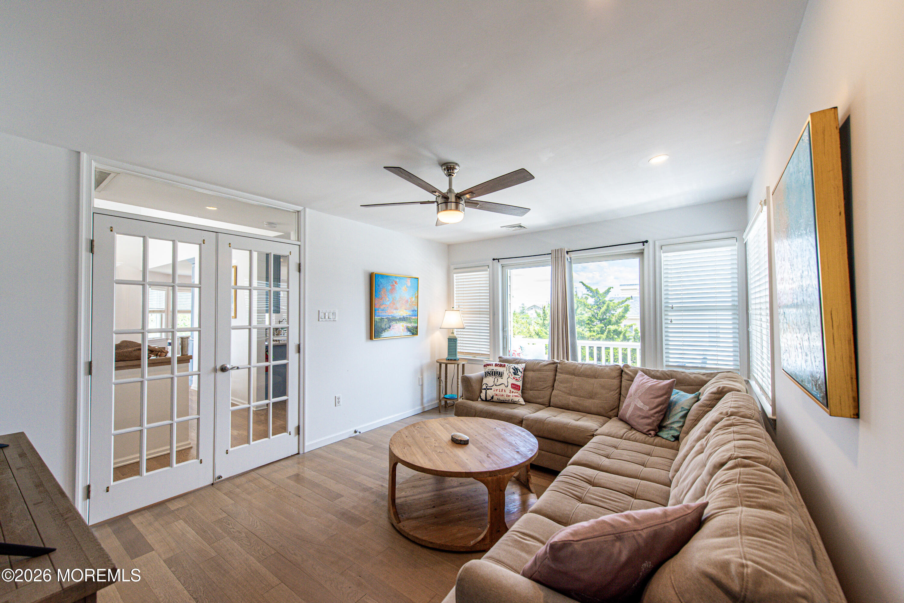 5 A Sunset Boulevard Barnegat Light, NJ 08006 - Photo 17 of 65 a living room with furniture a large window and wooden floor