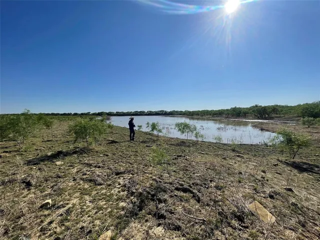 a view of a lake with a mountain in the background