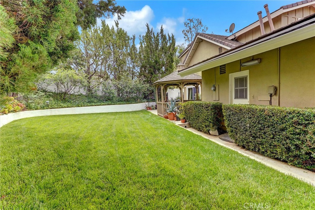 19238 Castlebay Lane Porter Ranch, CA 91326 - Photo 33 of 38 a front view of a house with a yard
