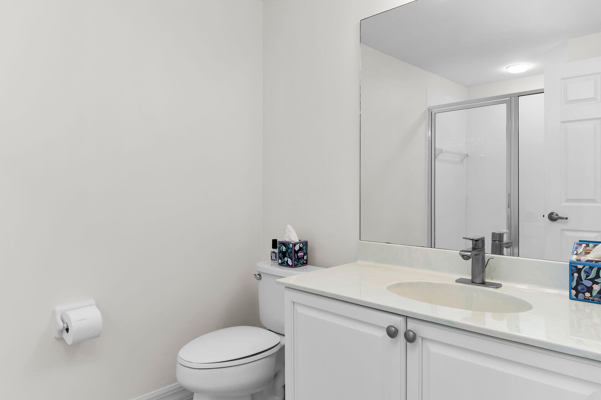 1111 Swallow Avenue, Unit 1401 Marco Island, FL 34145 - Photo 32 of 36 a bathroom with a sink a toilet and a mirror