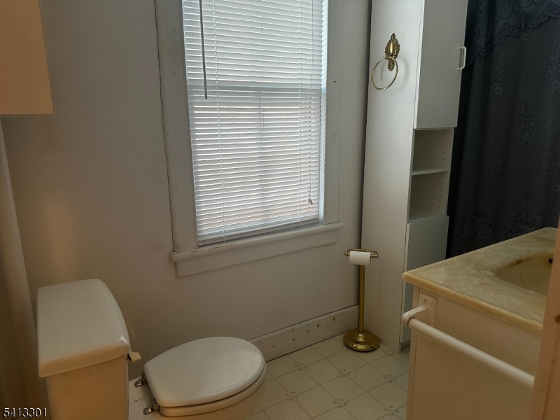 13 Ice Plant Road Lafayette, NJ 07848 - Photo 11 of 14 a bathroom with a toilet and a window