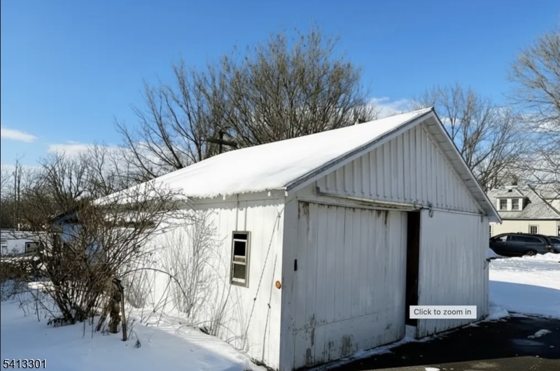 13 Ice Plant Road Lafayette, NJ 07848 - Photo 13 of 14 a view of small white house with a large tree and wooden fence