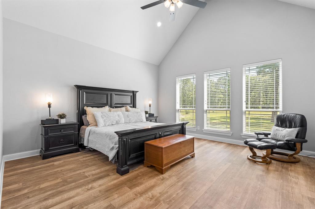 Tbd Tbd Anchor Point Quinlan, TX 75474 - Photo 15 of 40 a spacious bedroom with a bed and glass table