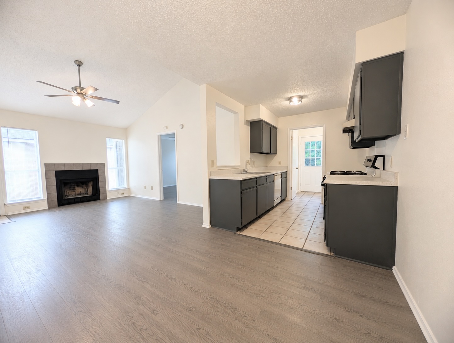 2016 Redwing Way Round Rock, TX 78664 - Photo 18 of 19 An open floor plan seamlessly connects the well-appointed kitchen to a bright living area with a fireplace.