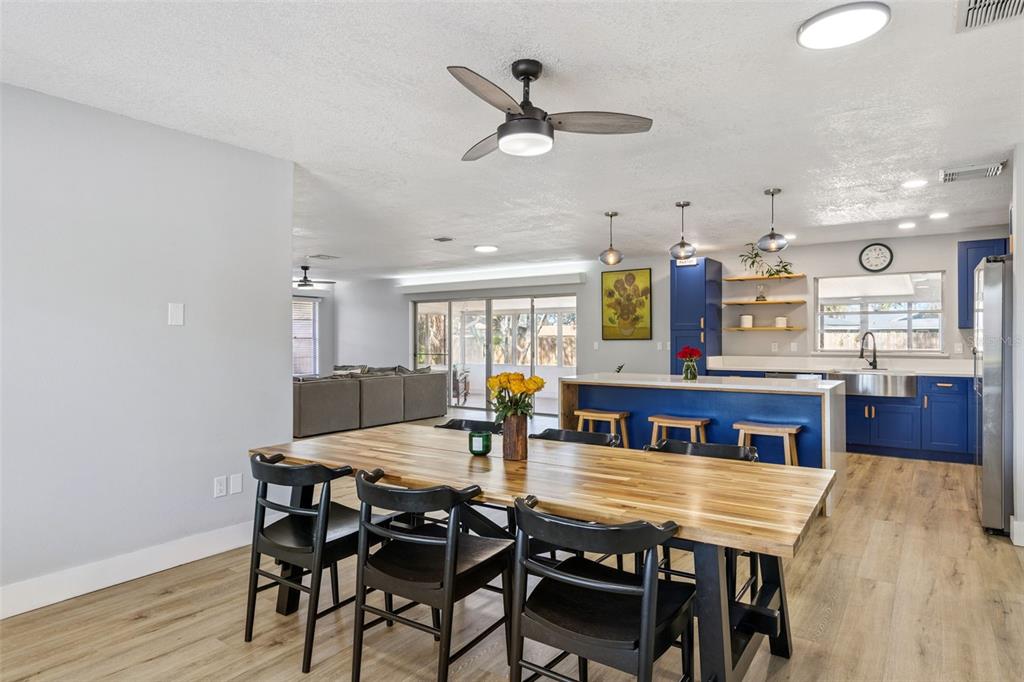 549 Iris Street Altamonte Springs, FL 32714 - Photo 12 of 28 a view of a dining room with furniture and wooden floor