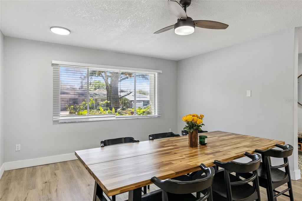 549 Iris Street Altamonte Springs, FL 32714 - Photo 13 of 28 a view of a dining room with furniture window and outside view