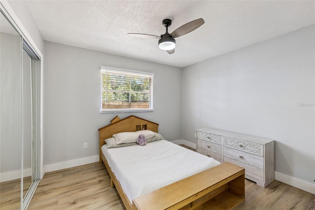 549 Iris Street Altamonte Springs, FL 32714 - Photo 20 of 28 a bedroom with a bed and a window