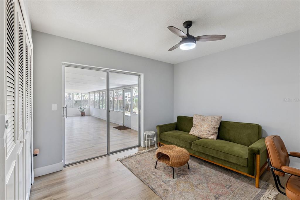 549 Iris Street Altamonte Springs, FL 32714 - Photo 23 of 28 a living room with furniture and a ceiling fan