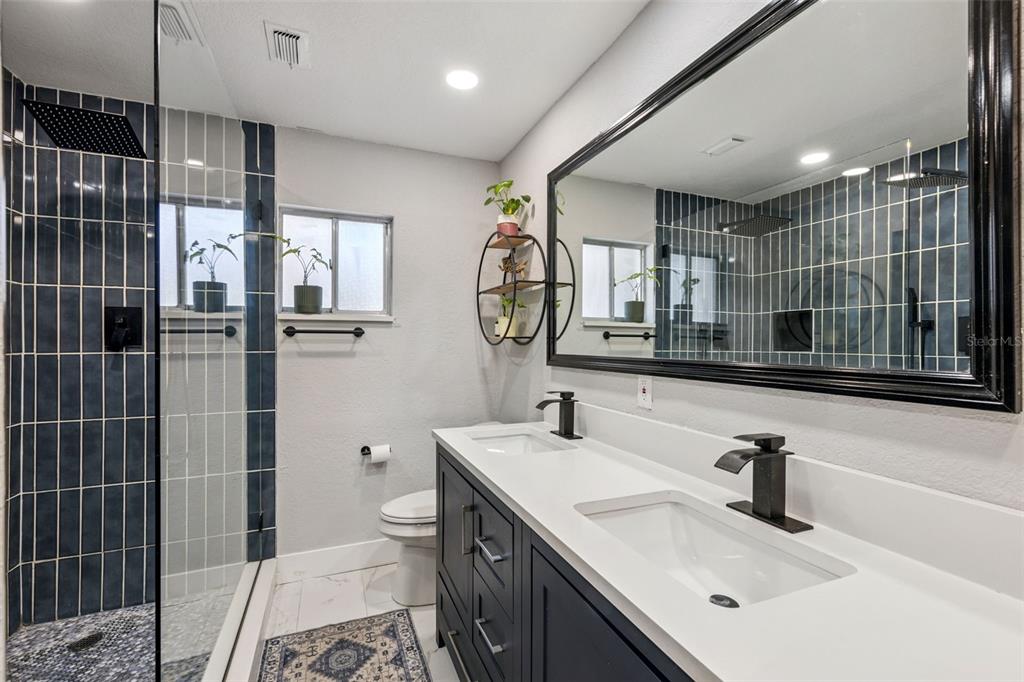 549 Iris Street Altamonte Springs, FL 32714 - Photo 3 of 28 a bathroom with a sink a toilet and shower