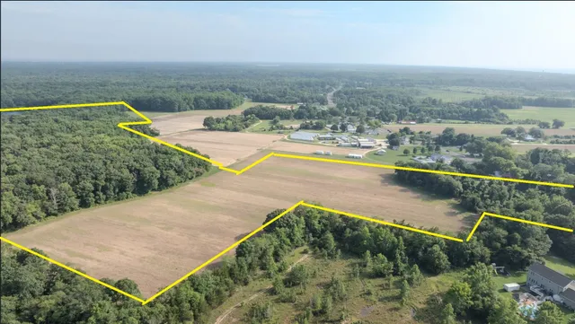 a aerial view of a house with a yard