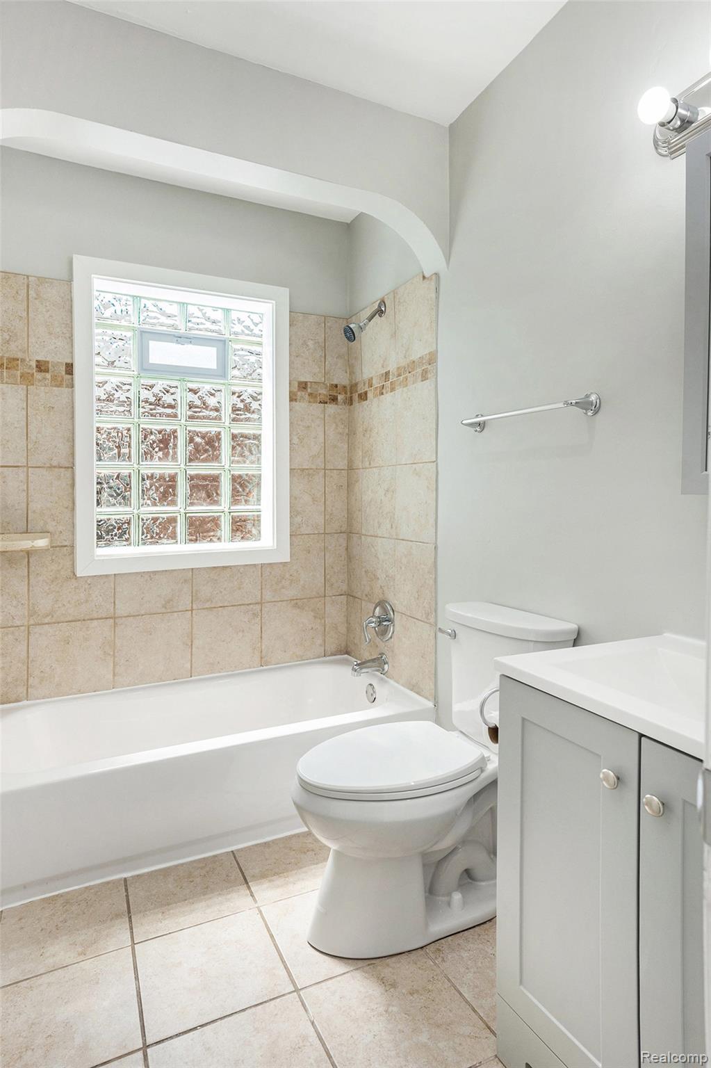 19315 Annchester Road Detroit, MI 48219 - Photo 11 of 17 Full bathroom with vanity, washtub / shower combination, and light tile patterned floors