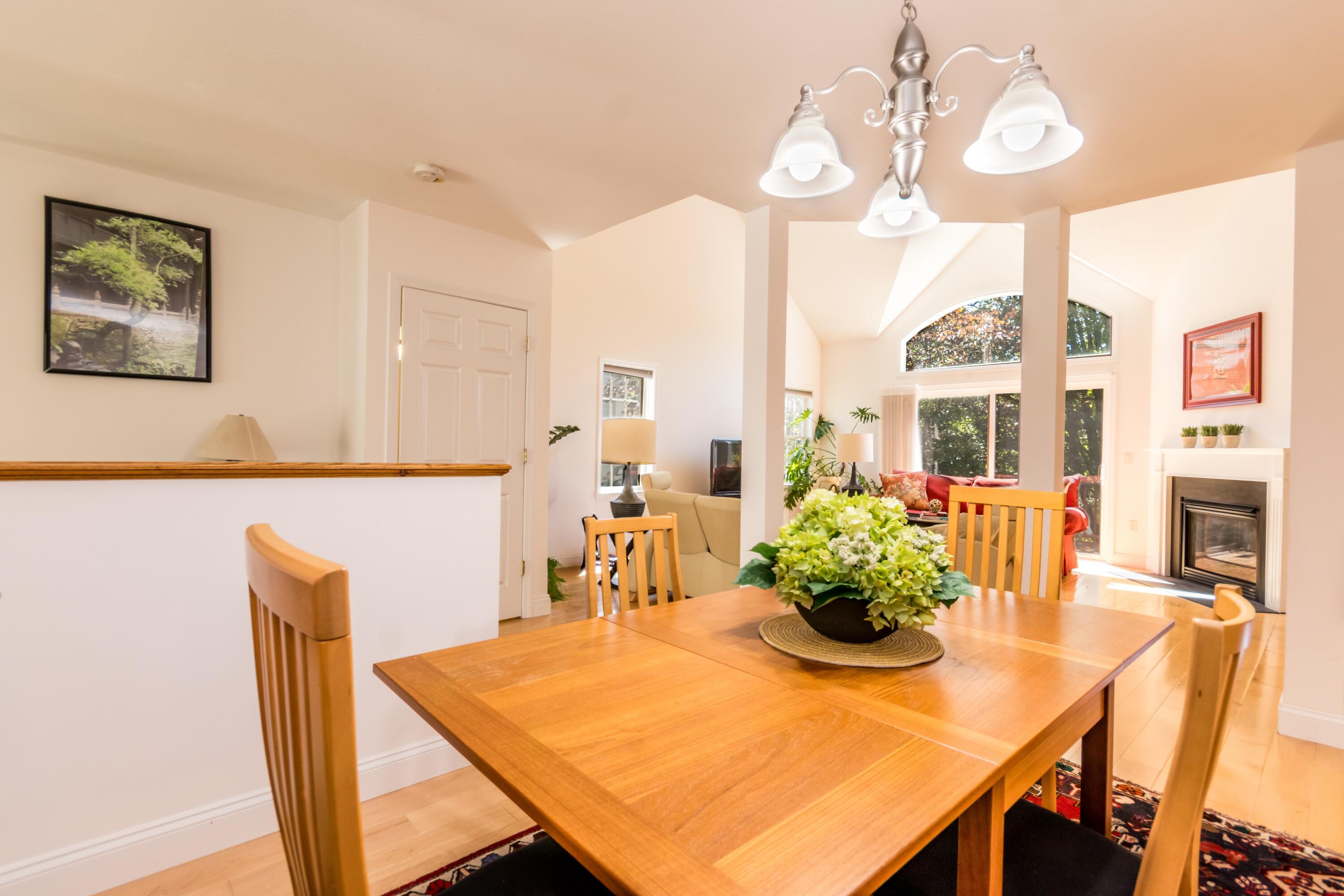 26 Carnoustie Road Bourne, MA 02532 - Photo 10 of 46 a view of a dining room with furniture and a chandelier