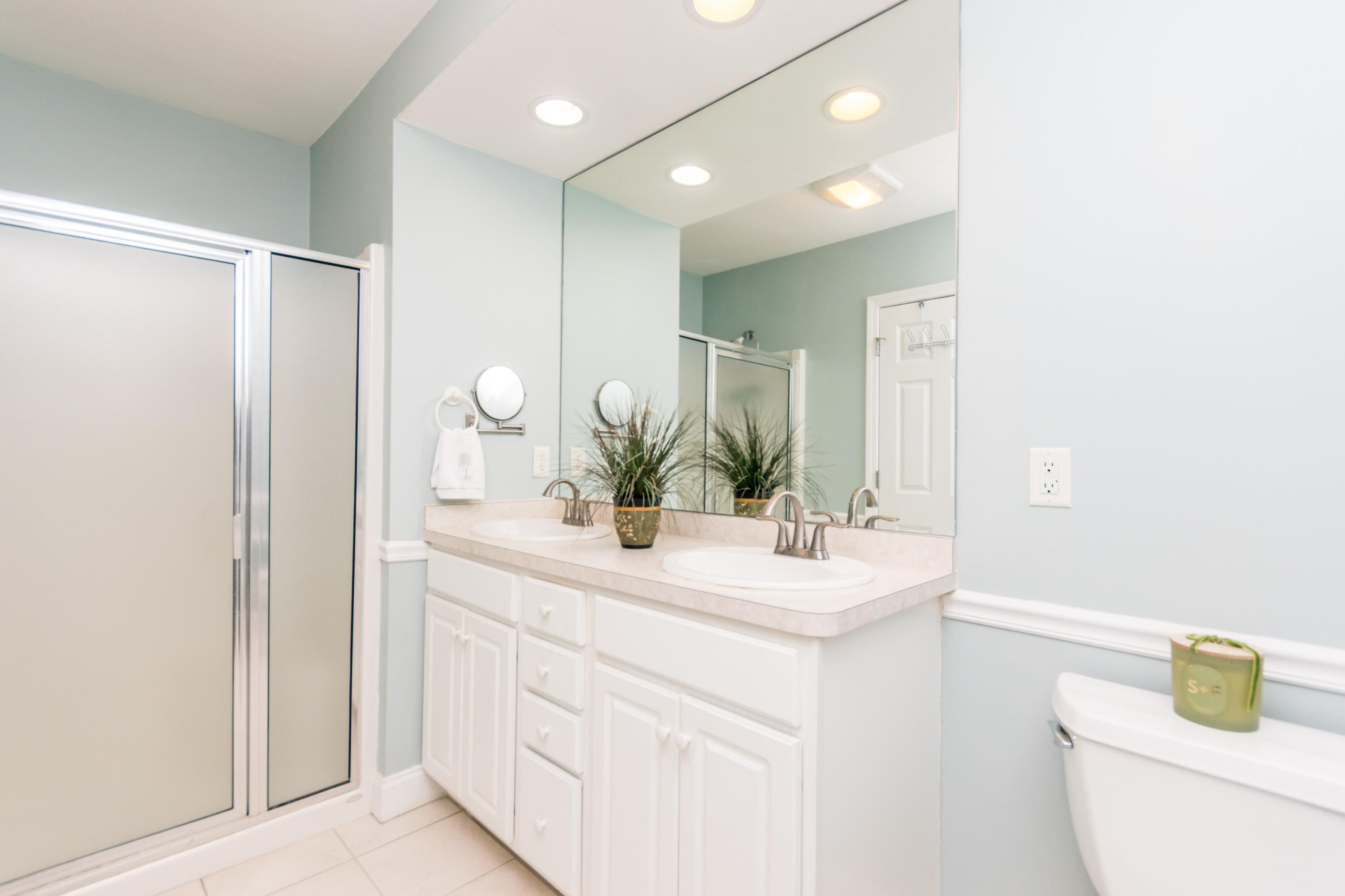 26 Carnoustie Road Bourne, MA 02532 - Photo 21 of 46 a bathroom with a sink a toilet and a mirror