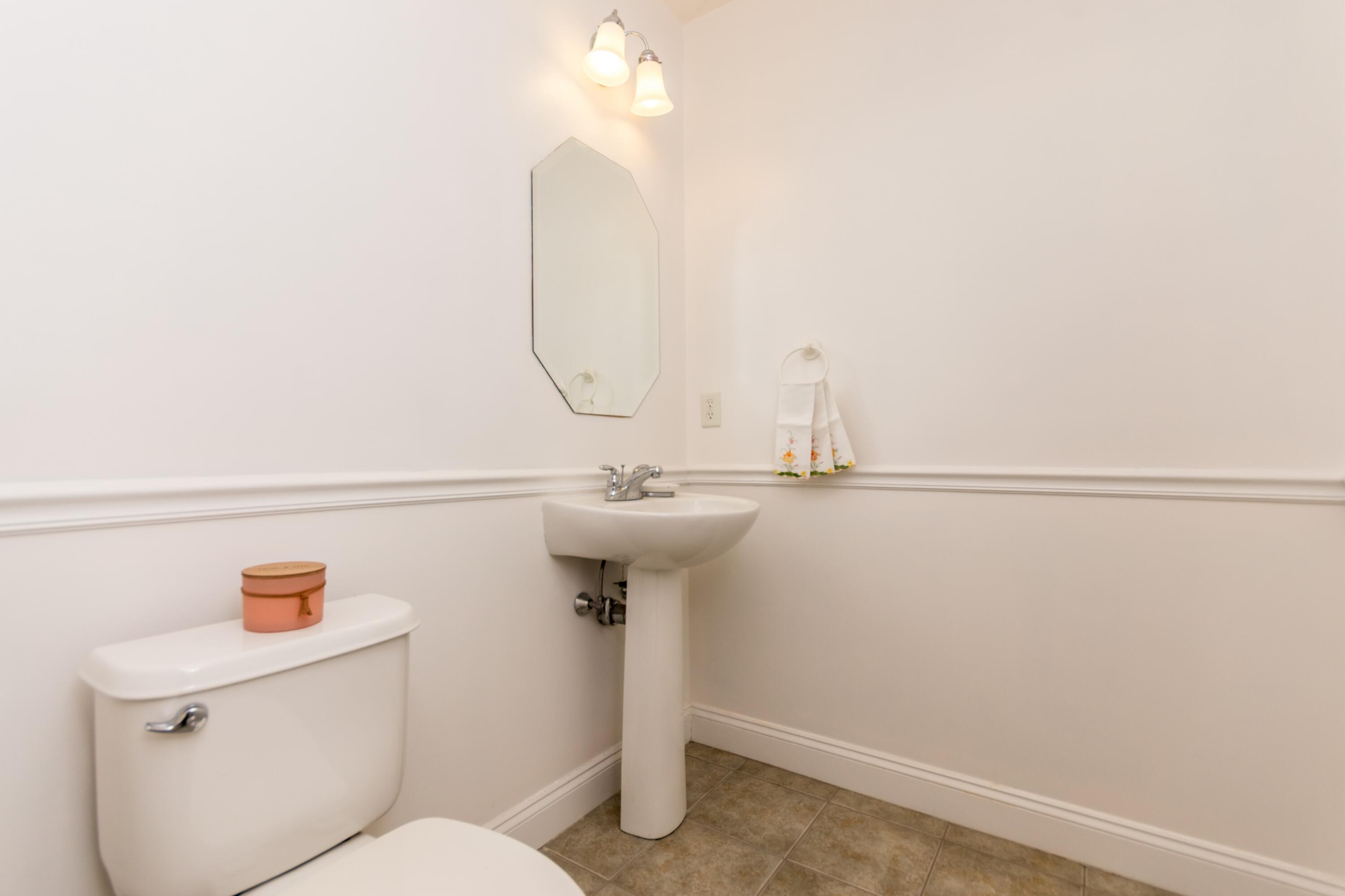 26 Carnoustie Road Bourne, MA 02532 - Photo 23 of 46 a bathroom with a sink a toilet and a mirror