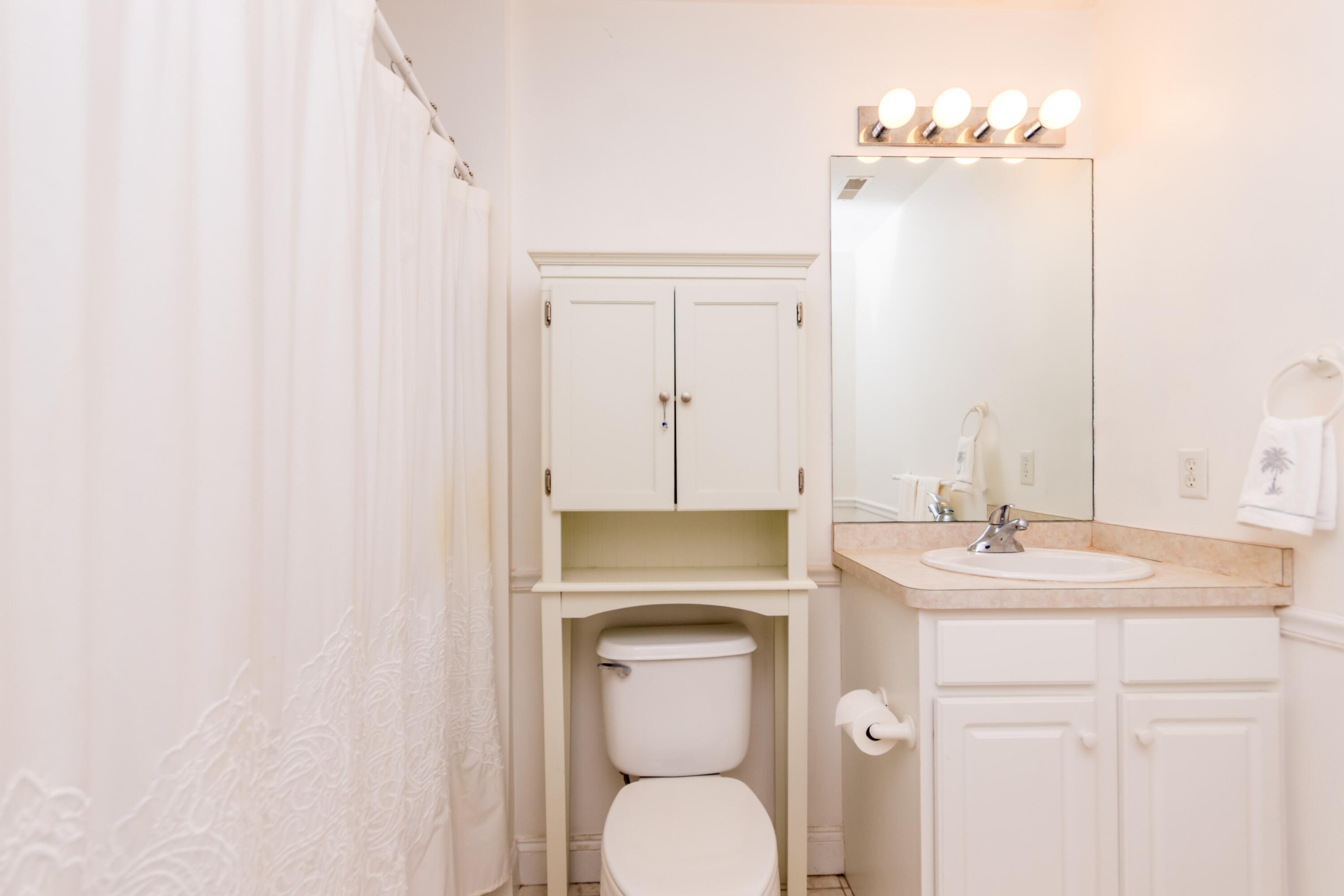 26 Carnoustie Road Bourne, MA 02532 - Photo 26 of 46 a bathroom with a toilet sink and mirror