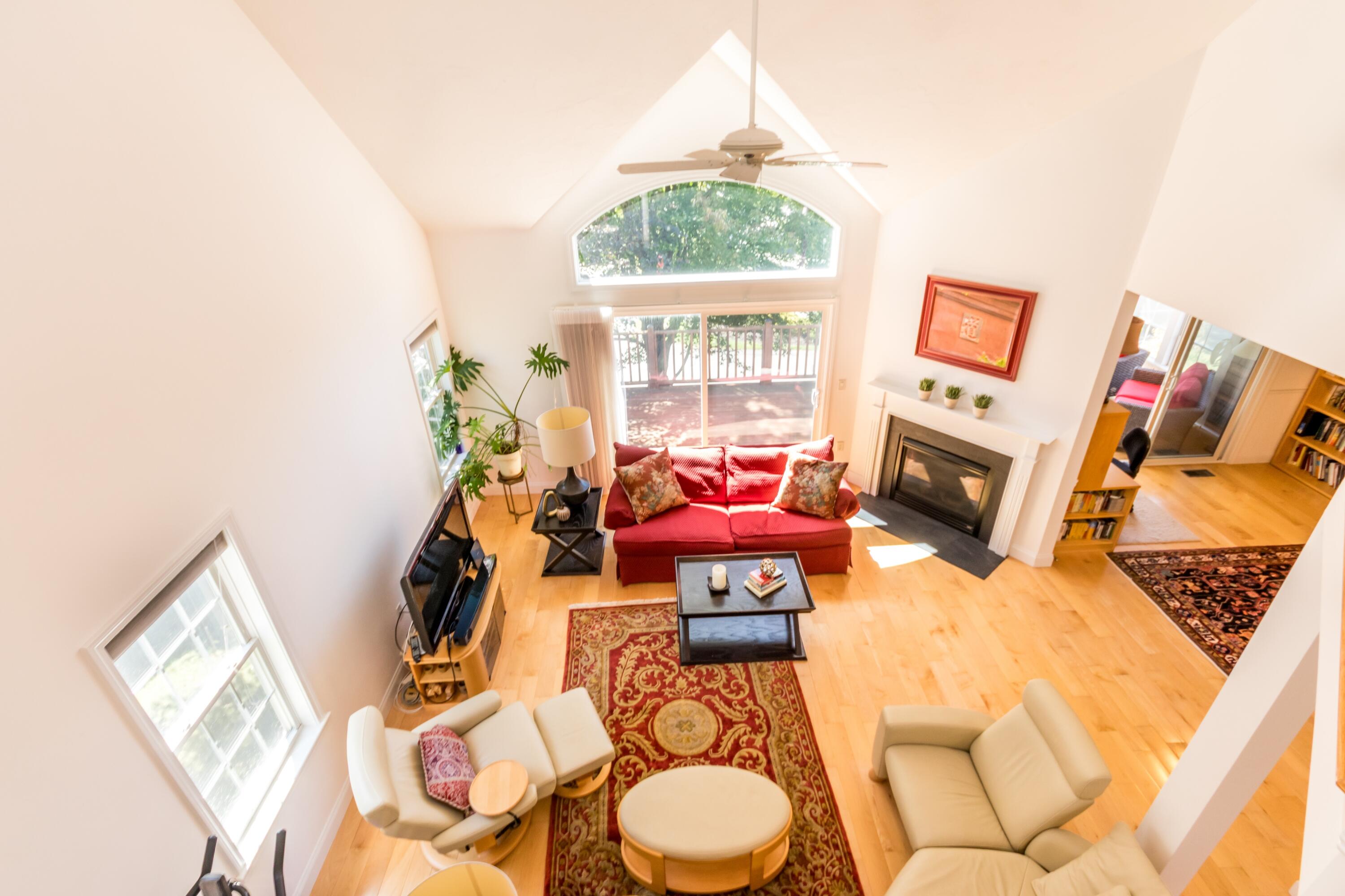 26 Carnoustie Road Bourne, MA 02532 - Photo 29 of 46 a living room with furniture a fireplace and a window