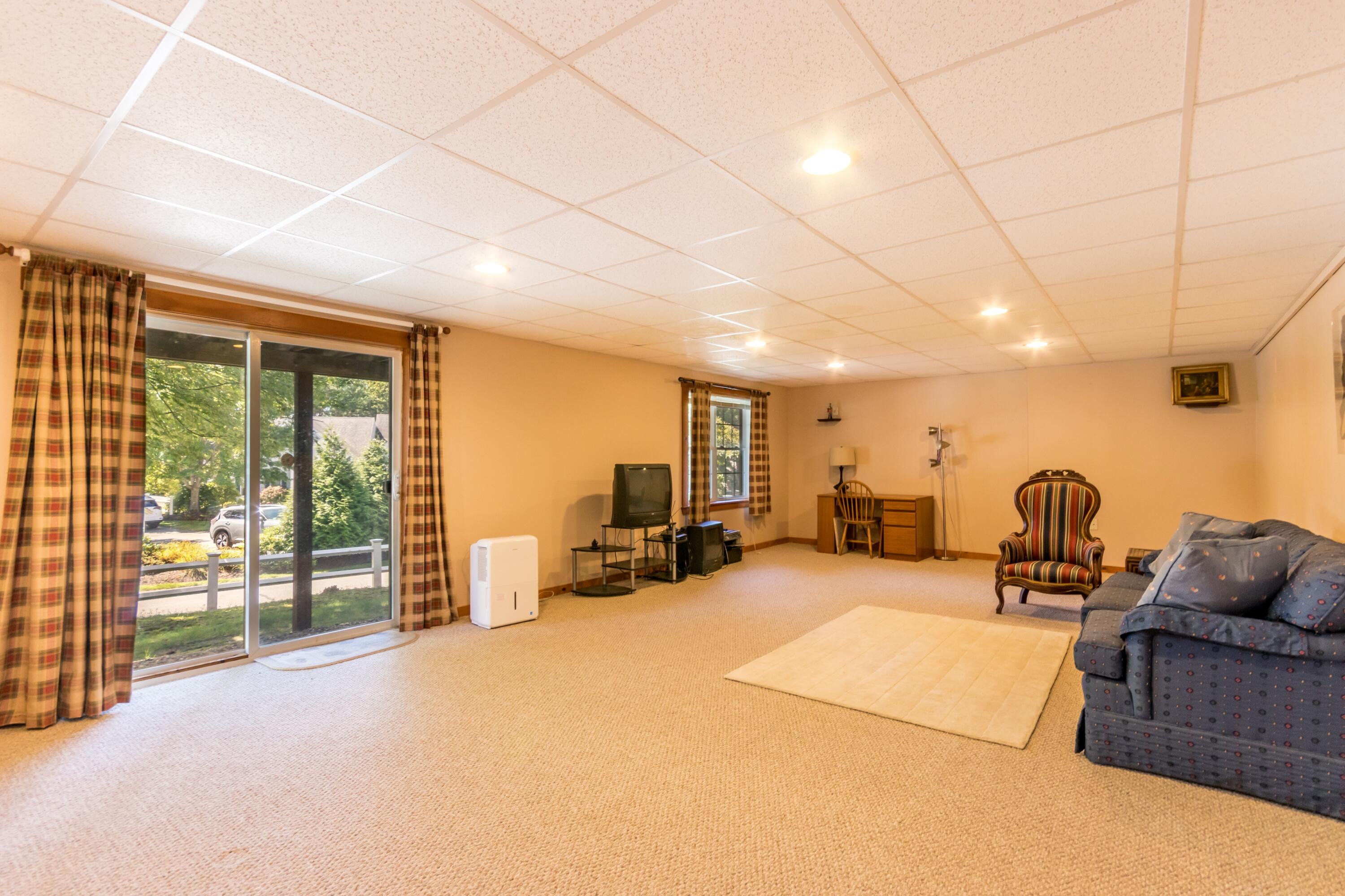 26 Carnoustie Road Bourne, MA 02532 - Photo 31 of 46 a living room with furniture and a flat screen tv