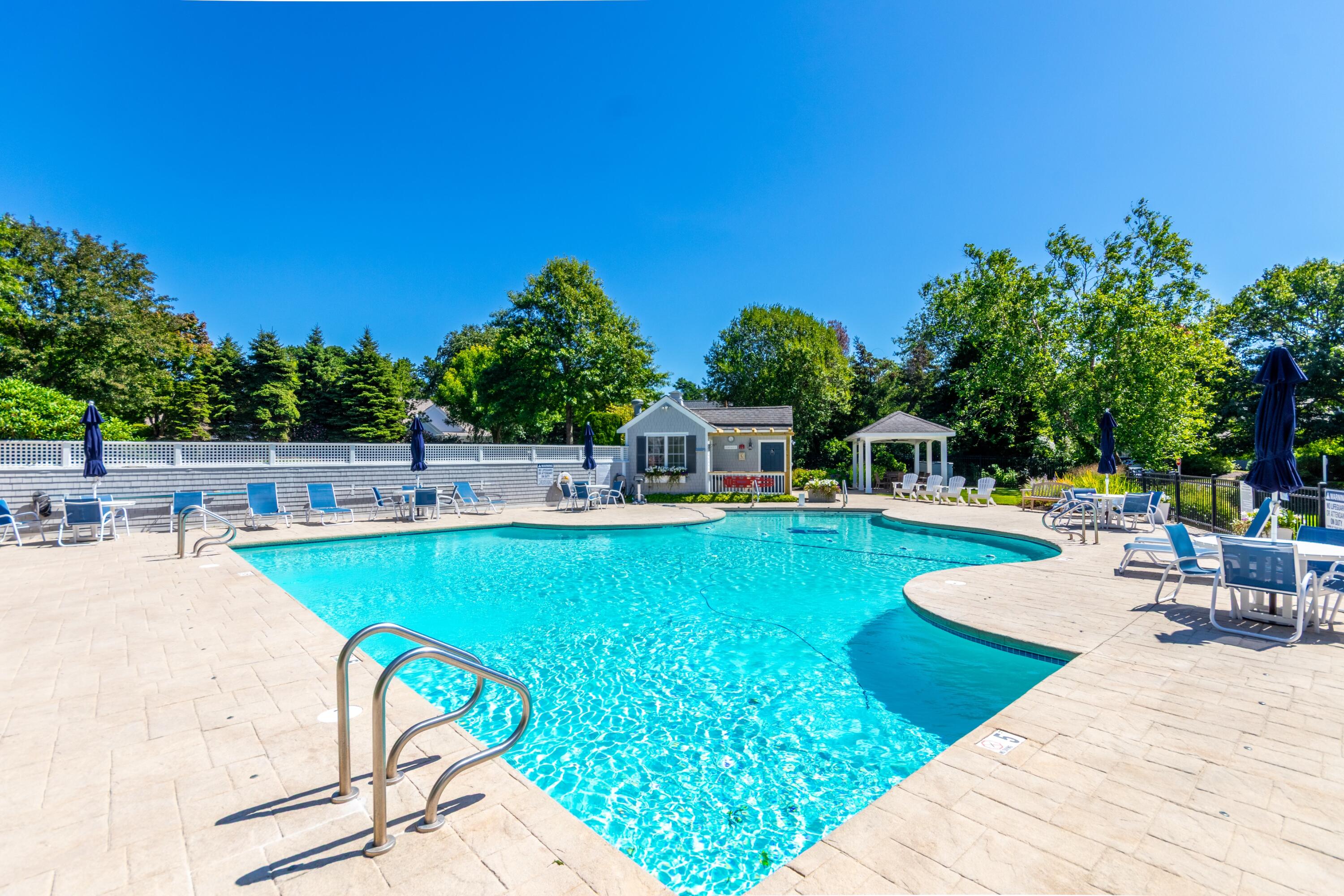 26 Carnoustie Road Bourne, MA 02532 - Photo 37 of 46 a view of a swimming pool with a patio
