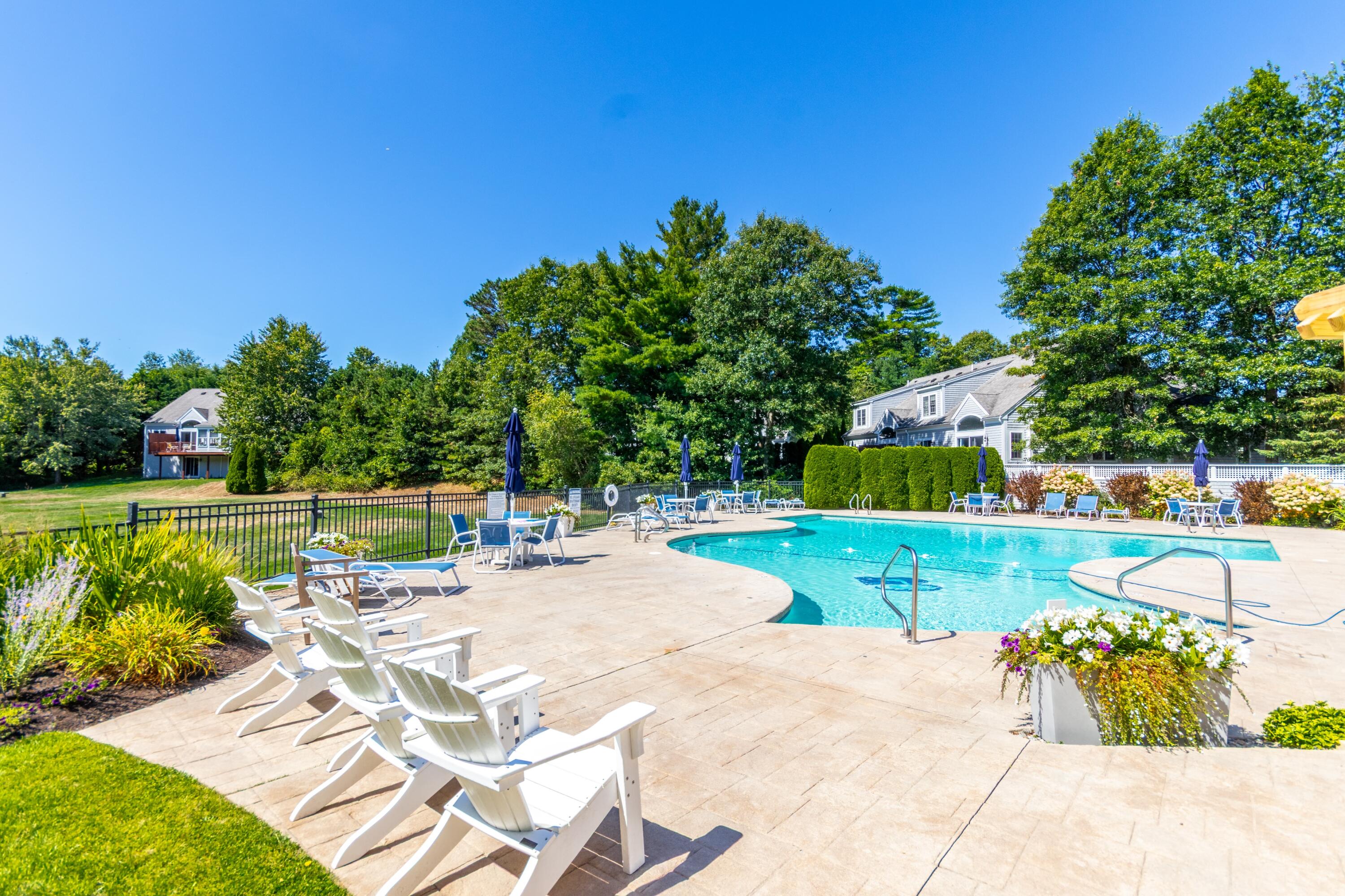26 Carnoustie Road Bourne, MA 02532 - Photo 38 of 46 a view of a swimming pool with a patio