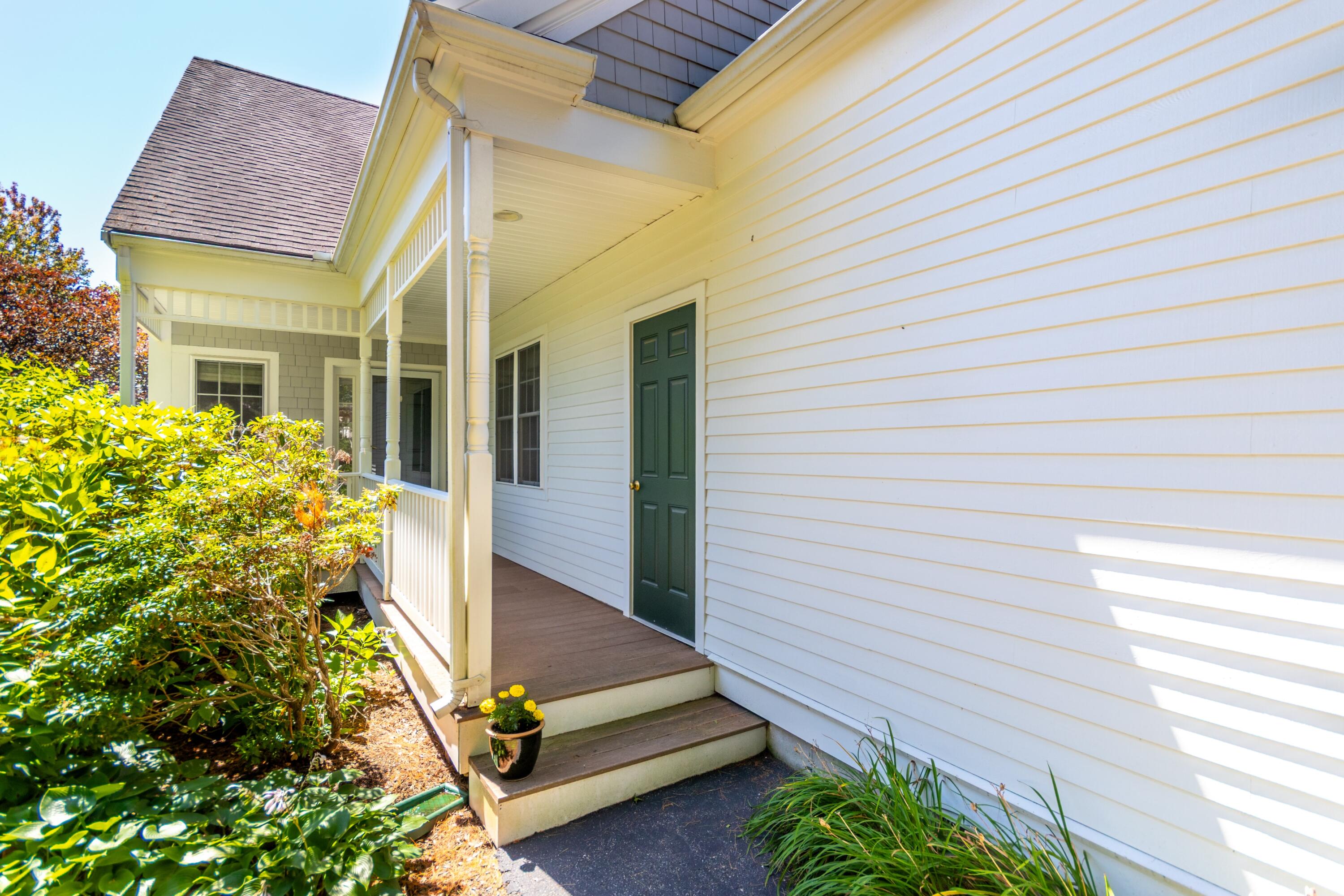 26 Carnoustie Road Bourne, MA 02532 - Photo 4 of 46 a front view of a house with a yard