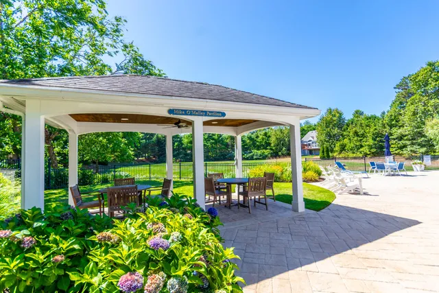 a view of a swimming pool with an outdoor space and seating area