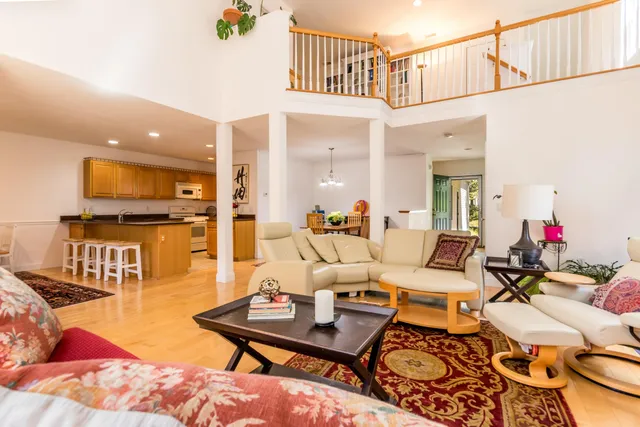 a view of a patio with a table chairs and a backyard