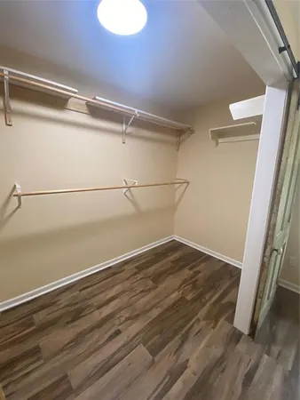a view of an empty walk in closet