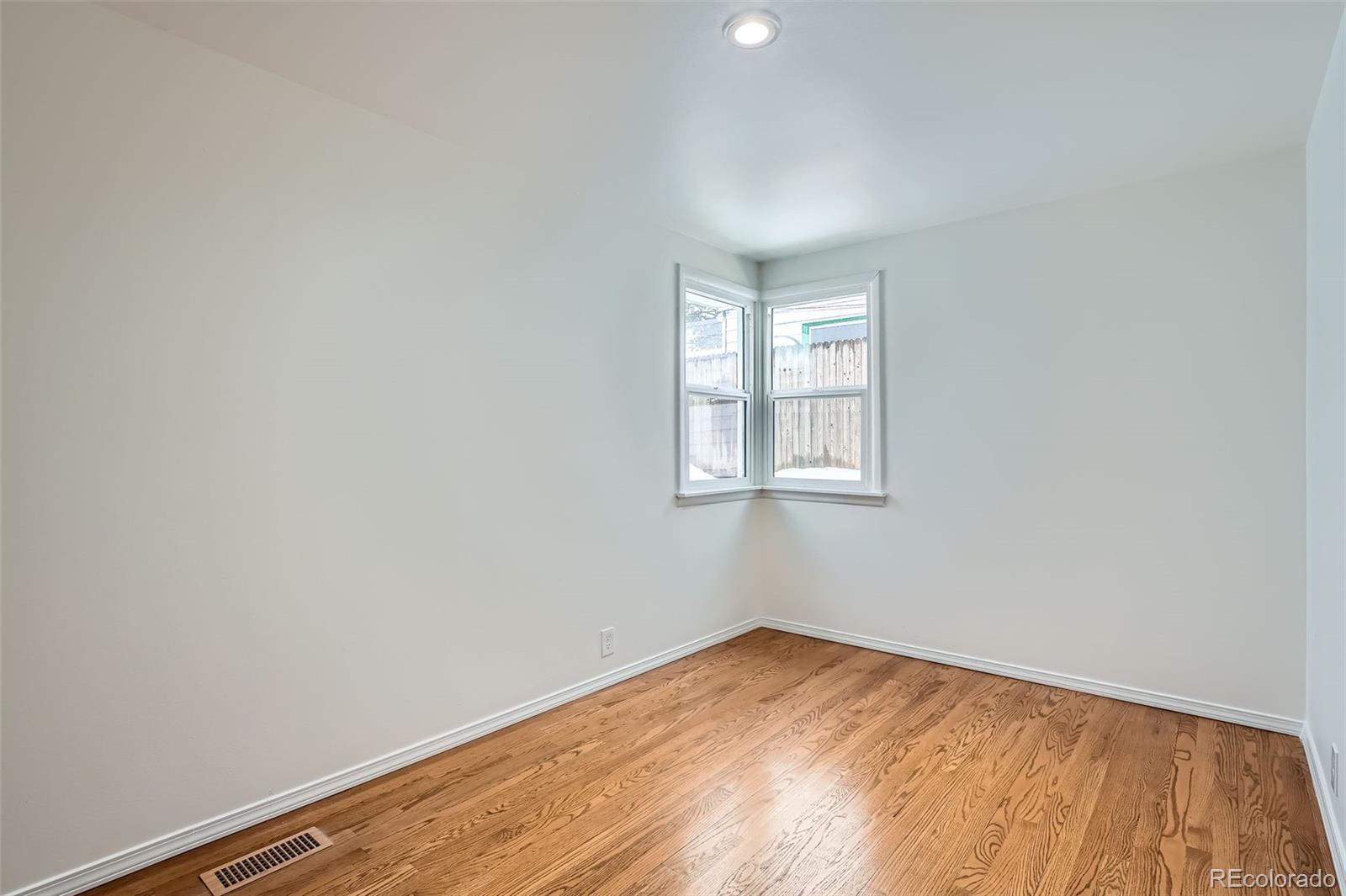 1720 South Java Way Denver, CO 80219 - Photo 13 of 28 an empty room with a window