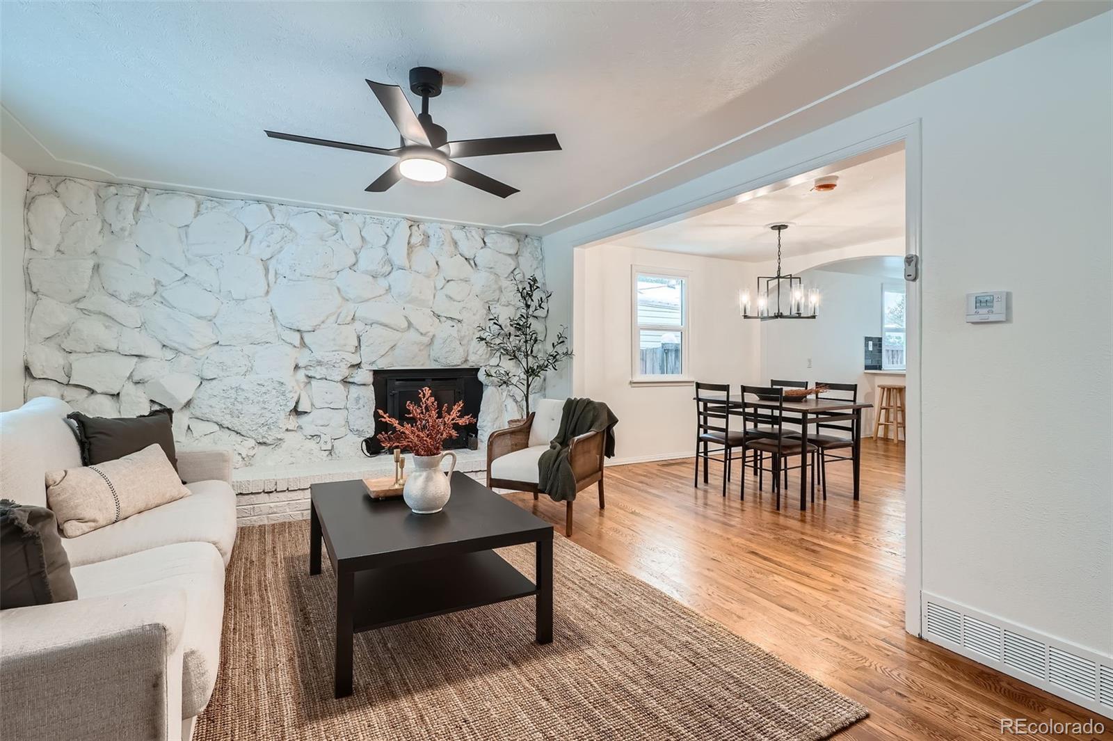 1720 South Java Way Denver, CO 80219 - Photo 2 of 28 a living room with furniture and a fireplace