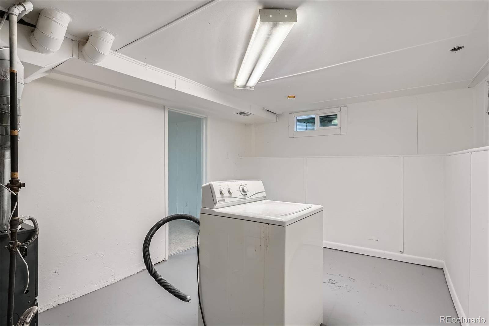 1720 South Java Way Denver, CO 80219 - Photo 21 of 28 a utility room with dryer and washer